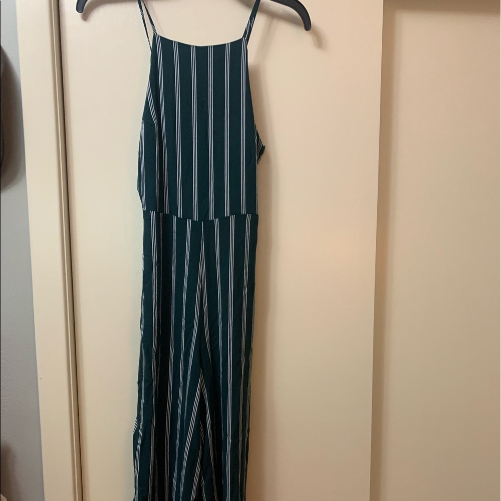 Wide legged romper . 100% Rayon. Spaghetti straps with a square neckline.